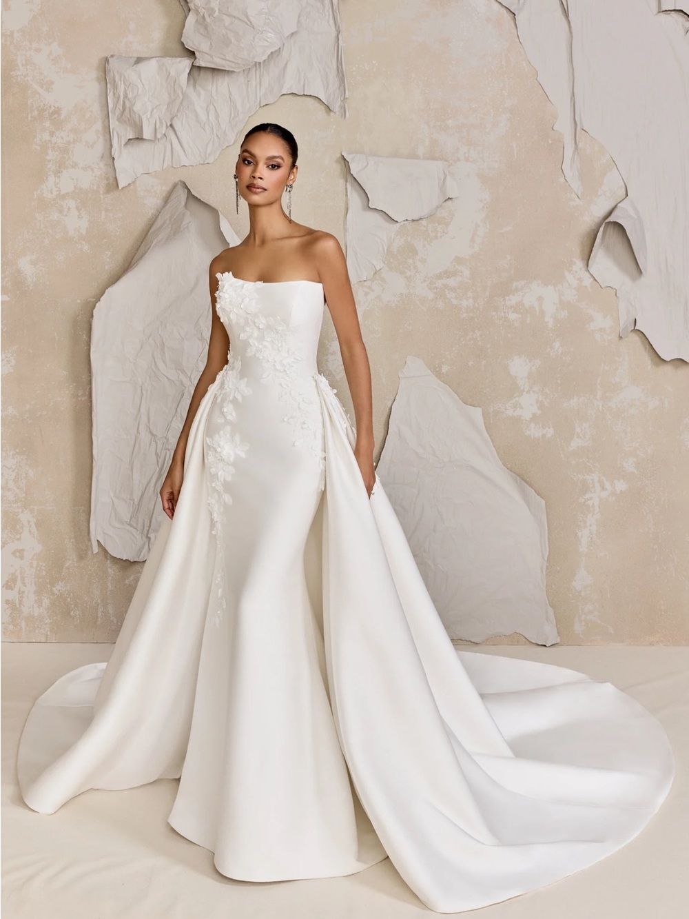 Strapless White Bridal Gown with Floral Appliqué and Detachable Overskirt